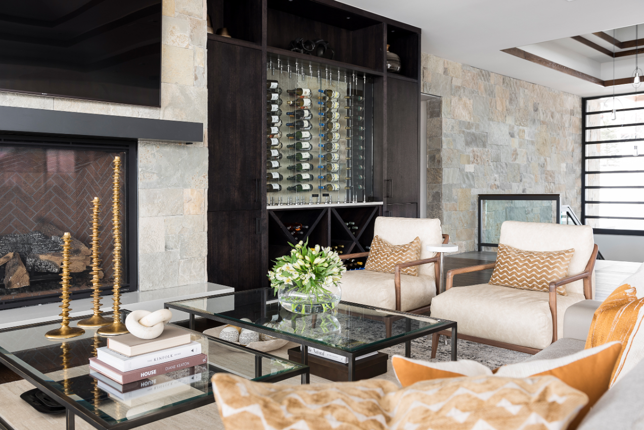 Elegant custom home living room with wine rack and fireplace - Tall Pines Construction