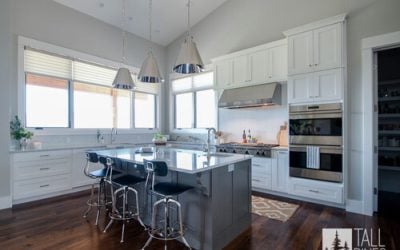 Open-concept kitchen with island seating by Tall Pines Construction, exemplifying Park City new construction