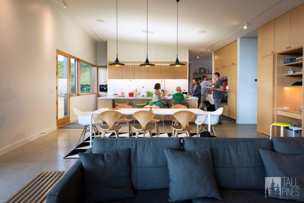 This home uses warm wood and an open floor plan to create a contemporary kitchen. 