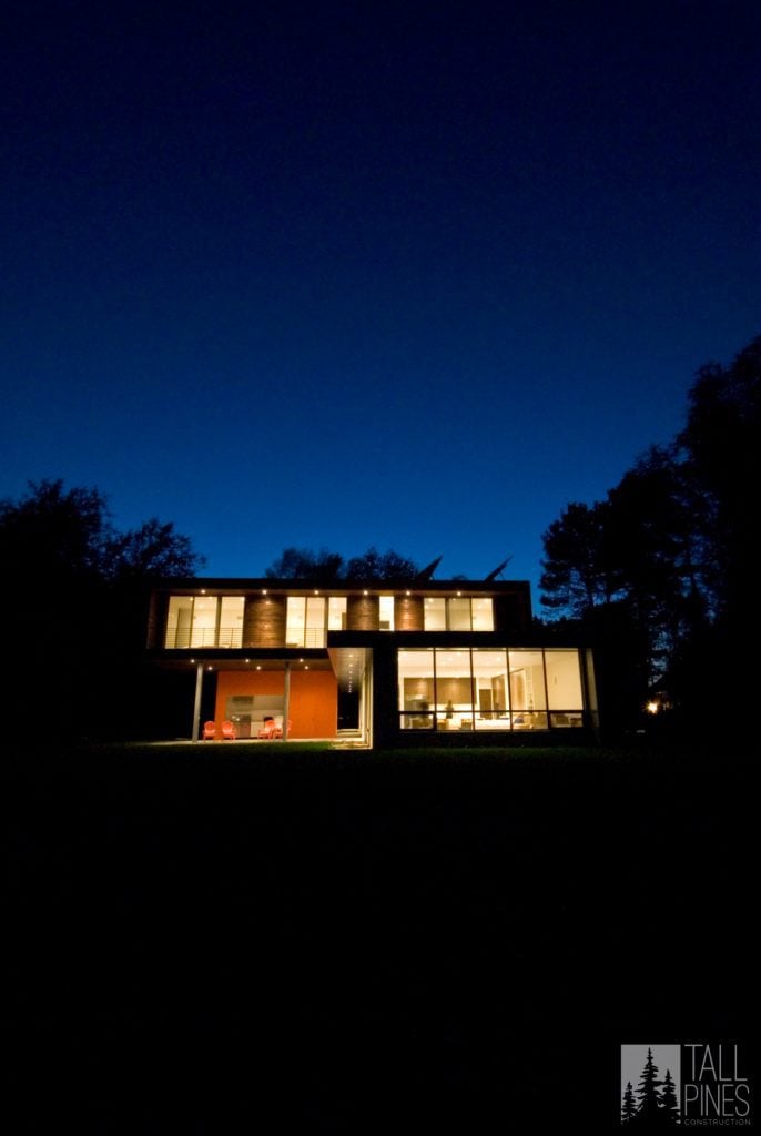 When building a custom mountain modern home, windows are of the utmost importance. Seeing this home all lit up at night just goes to show you can never have too many windows to take in the view.