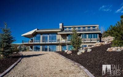 Exterior view of a modern Park City home, showcasing contemporary architecture and mountain surroundings.