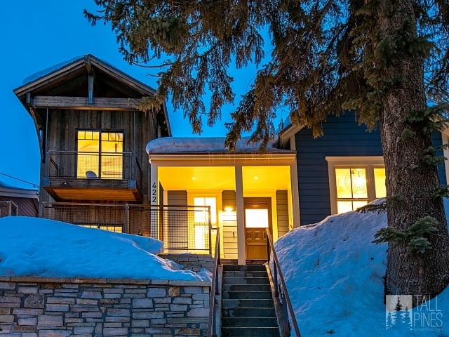 This custom home has everything you need to enjoy all the outdoor adventures of the area, with a ski locker room and stunning outdoor views. But it also has a cozy kitchen, inviting bedrooms, and plenty of space for guests.