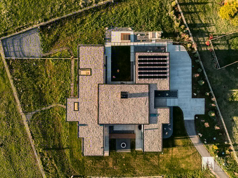 Aerial Top-Down View of Modern Mountain Home in Park City, Utah Top-down aerial view of a flat-roof modern home in Park City with landscaped yard and surrounding open land.
