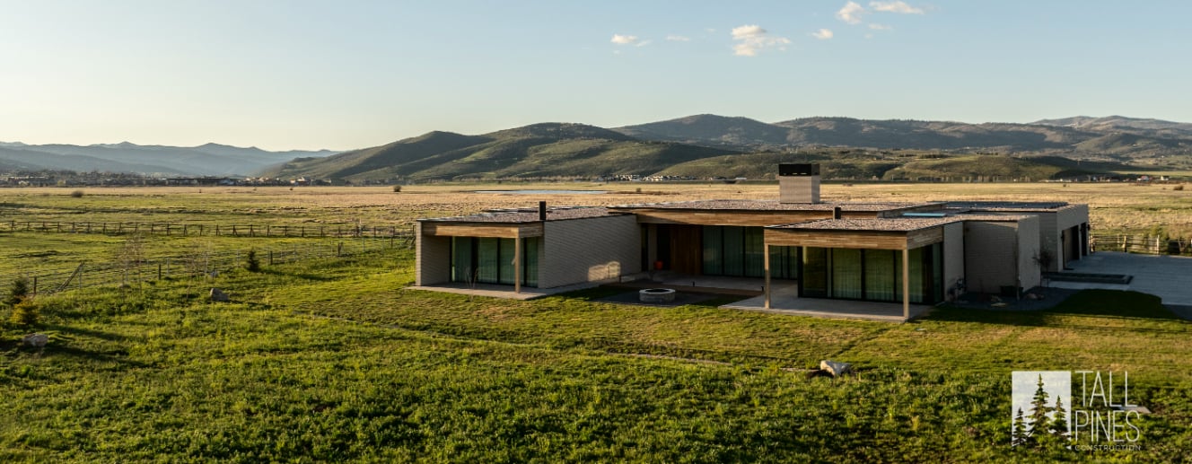 Luxury modern home in Park City, Utah, designed with flat roofs, expansive windows, and mountain views.