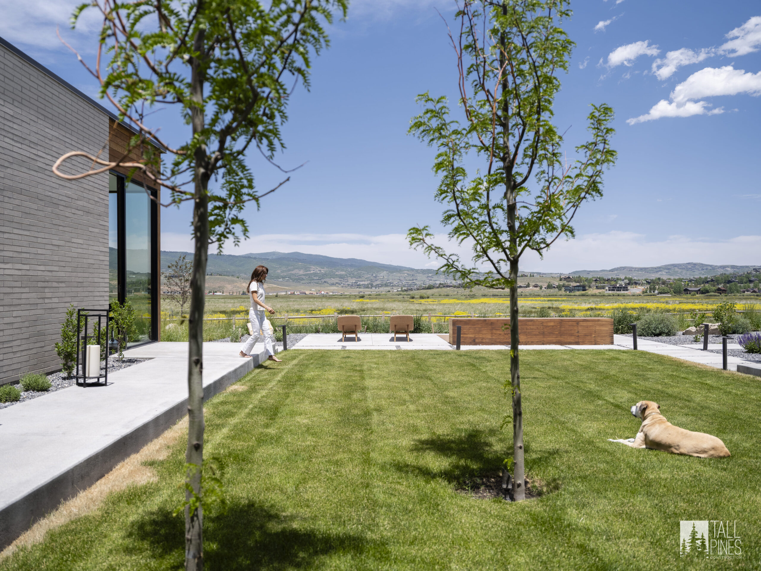 A landscaped backyard with mountain views for a Park City construction project by Tall Pines Construction in Park City, Utah.