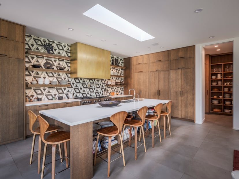 Modern Custom Kitchen in Park City Home A modern custom kitchen featuring warm wood cabinetry, a large island, and curated finishes that reflect Tall Pines Construction’s attention to detail and functionality.