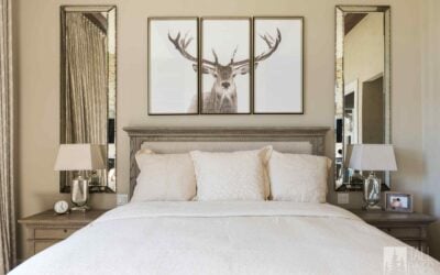 Mountain modern bedroom with expansive windows and neutral paint tones in a Park City custom home built by Tall Pines Construction.