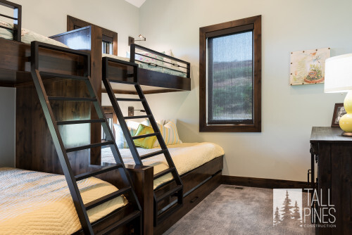 There are lots of extra features you can include in your bunk room. Amenities like individual lights and switches, TVs, privacy curtains, shelves or drawers, outlets, and charging plugs can give your guests a little personal space and privacy and really drive home the modern mountain luxury feel of the room.