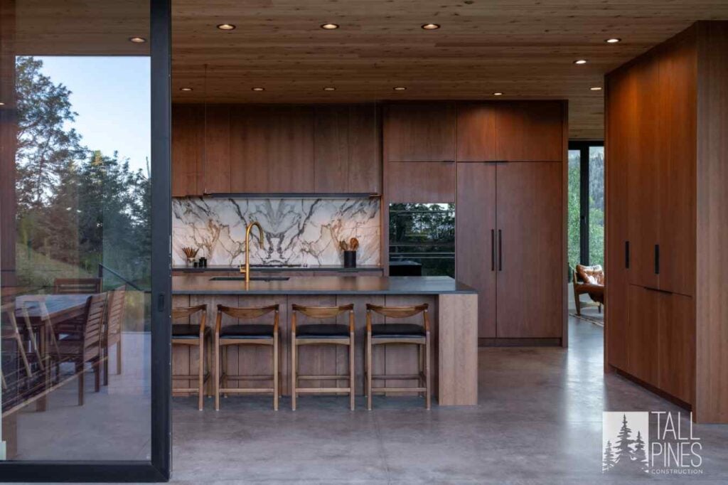 Luxury kitchen in a Park City custom home featuring dark wood cabinetry, premium finishes, and an open-concept layout for entertaining.