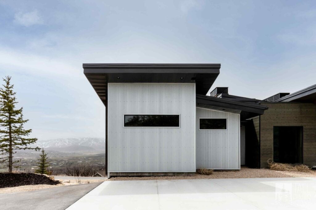 Modern Park City custom home exterior featuring clean architectural lines, metal siding, and expansive mountain views.
