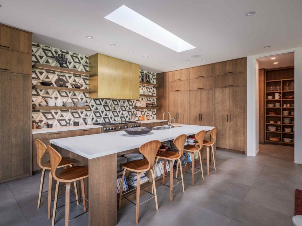 Contemporary kitchen in a Park City custom home with a large island, designer finishes, and seamless indoor-outdoor connectivity.