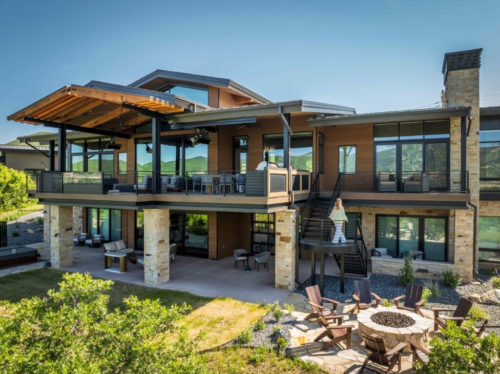 Outdoor entertaining area at a Park City custom home featuring covered patios, mountain views, and spaces designed for year-round living.