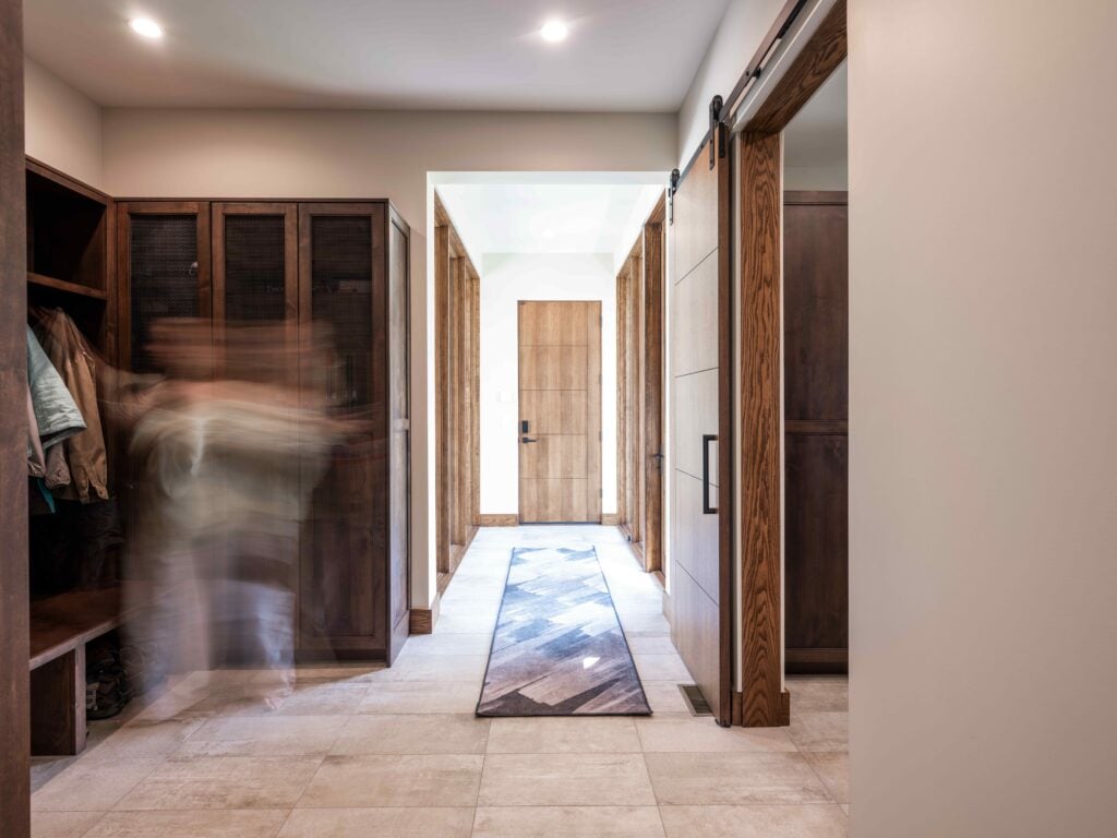Functional mudroom inside a Park City custom home designed with custom storage for ski gear, outerwear, and everyday mountain living.