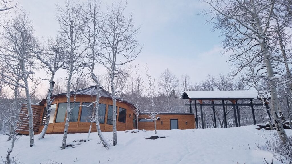 custom yurt build, four-season home Snow-covered Park City yurt nestled among aspens, highlighting a custom-built luxury mountain retreat designed for every season.