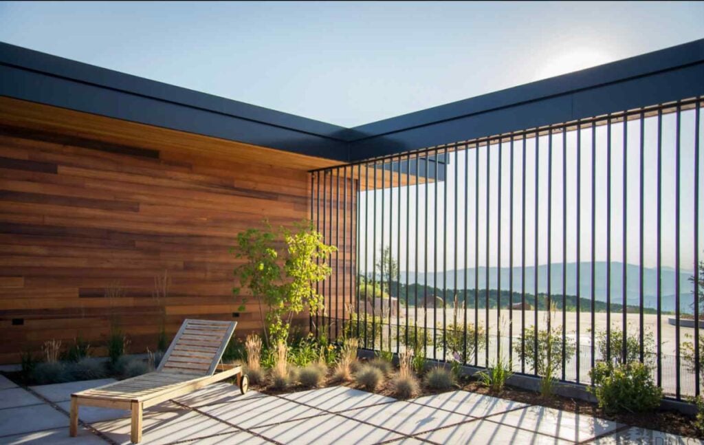 Sunlit outdoor space of a modern Park City home illustrating thoughtful orientation, natural materials, and passive solar design principles.