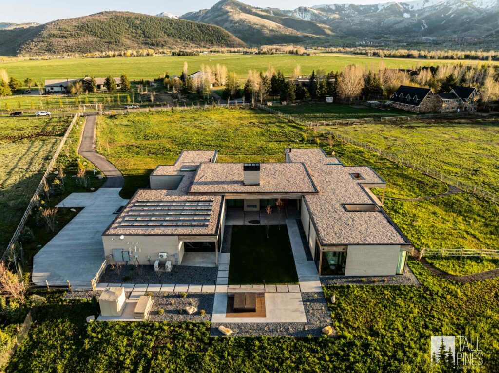 Aerial view of a contemporary custom home on a large property near Park City, Utah.