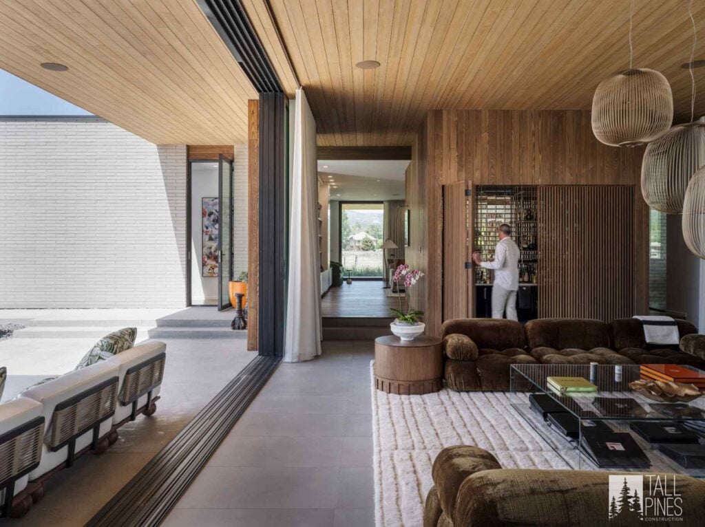 Luxury Park City custom home featuring wood finishes and a seamless indoor-outdoor living space.