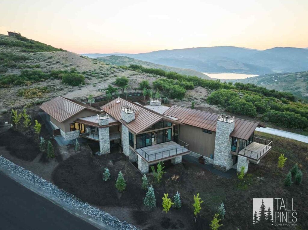 Aerial view of a mountain modern home in Park City, Utah designed to complement the surrounding landscape.