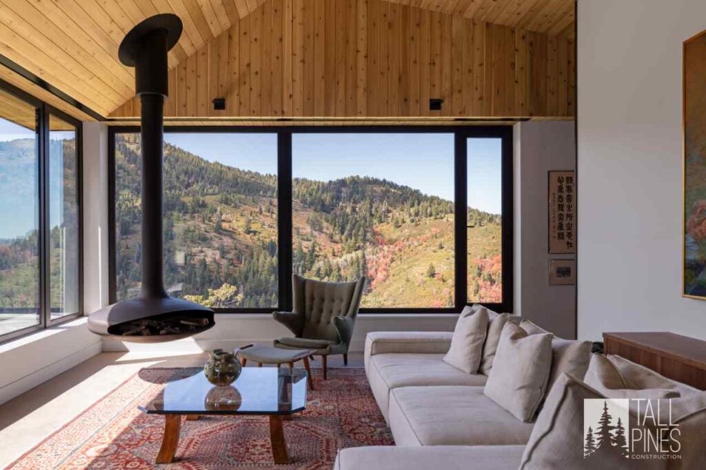 Mountain modern living room with natural wood ceilings, expansive windows, and views of the Park City mountains.